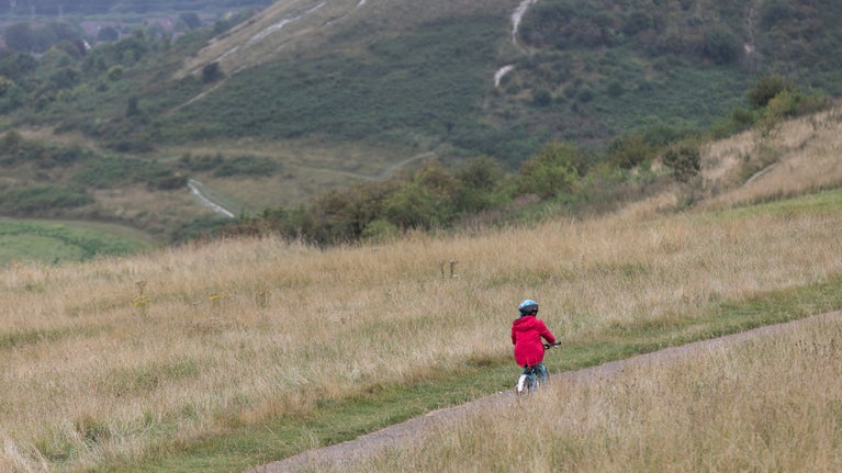 Bike rider in autumn at Dunstable Downs and Whipsnade Estate, Bedfordshire